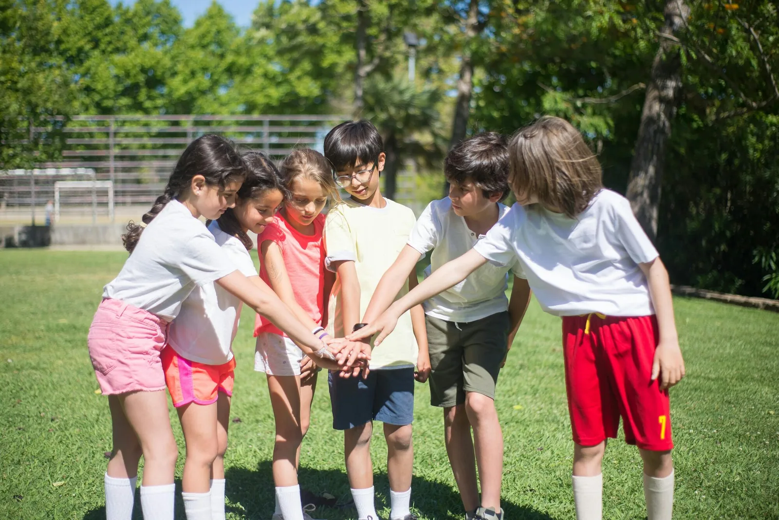 Young volleyball players gathered together as a team